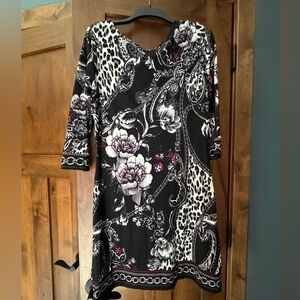 Classy fitted dress with soft drooped neck line. Flattering. Size M.